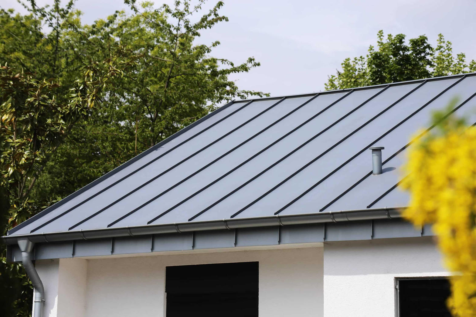 Standing seam metal roof panels on a residential home